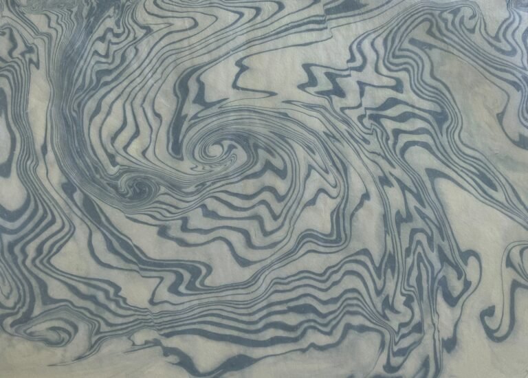 “In Motion 2”, 2024, Suminagashi, japanese dyeing technique, japanese paper, ink, 30. by Sabine Thornau, exhibited at Domio Gallery.